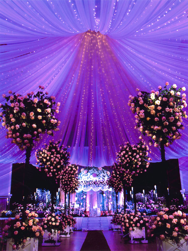 ceremony-decor-draped-fabric-purple-lighting